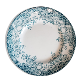 Assiette en faïence ancienne à décor de couronne de fleurs