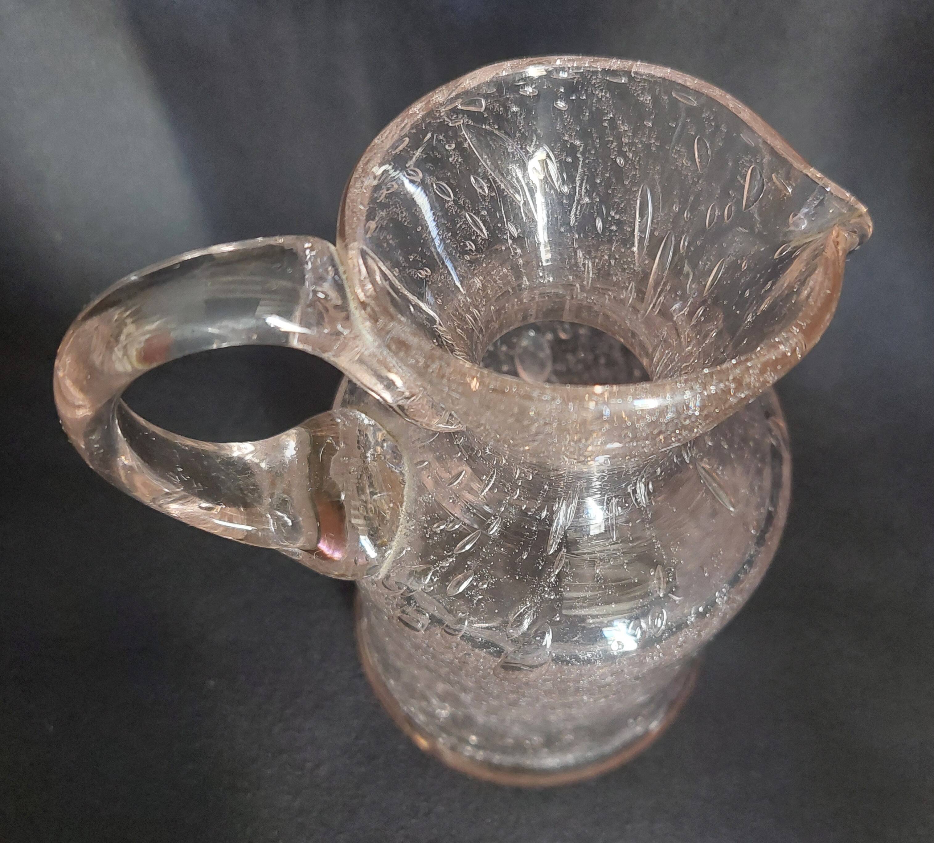 Small blown glass pitcher with bubbles from the 20th century.