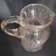 Small blown glass pitcher with bubbles from the 20th century.