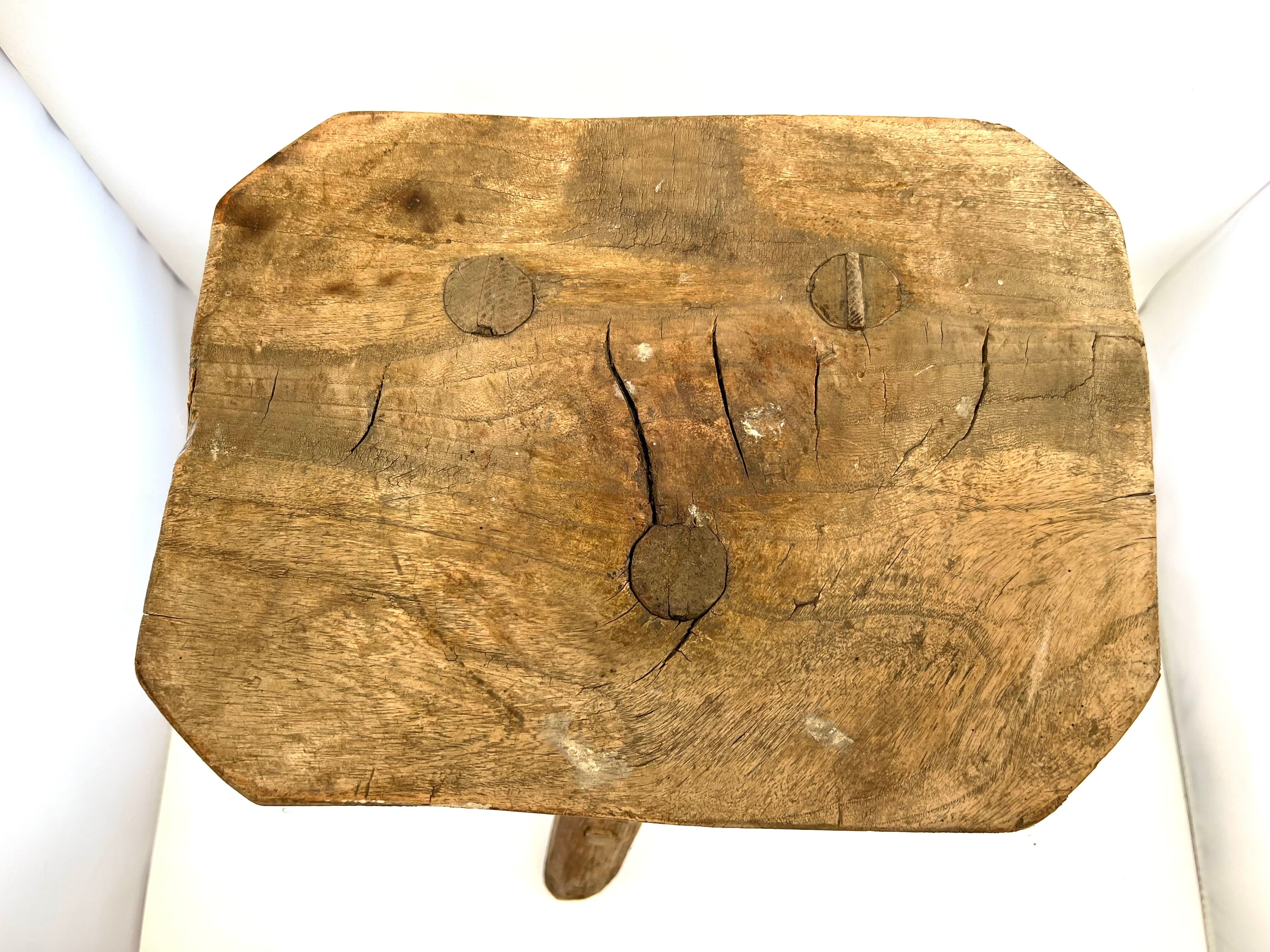 Rustic tripod wood stool