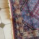 Tapis d'Orient persan ancien en laine à médaillon central