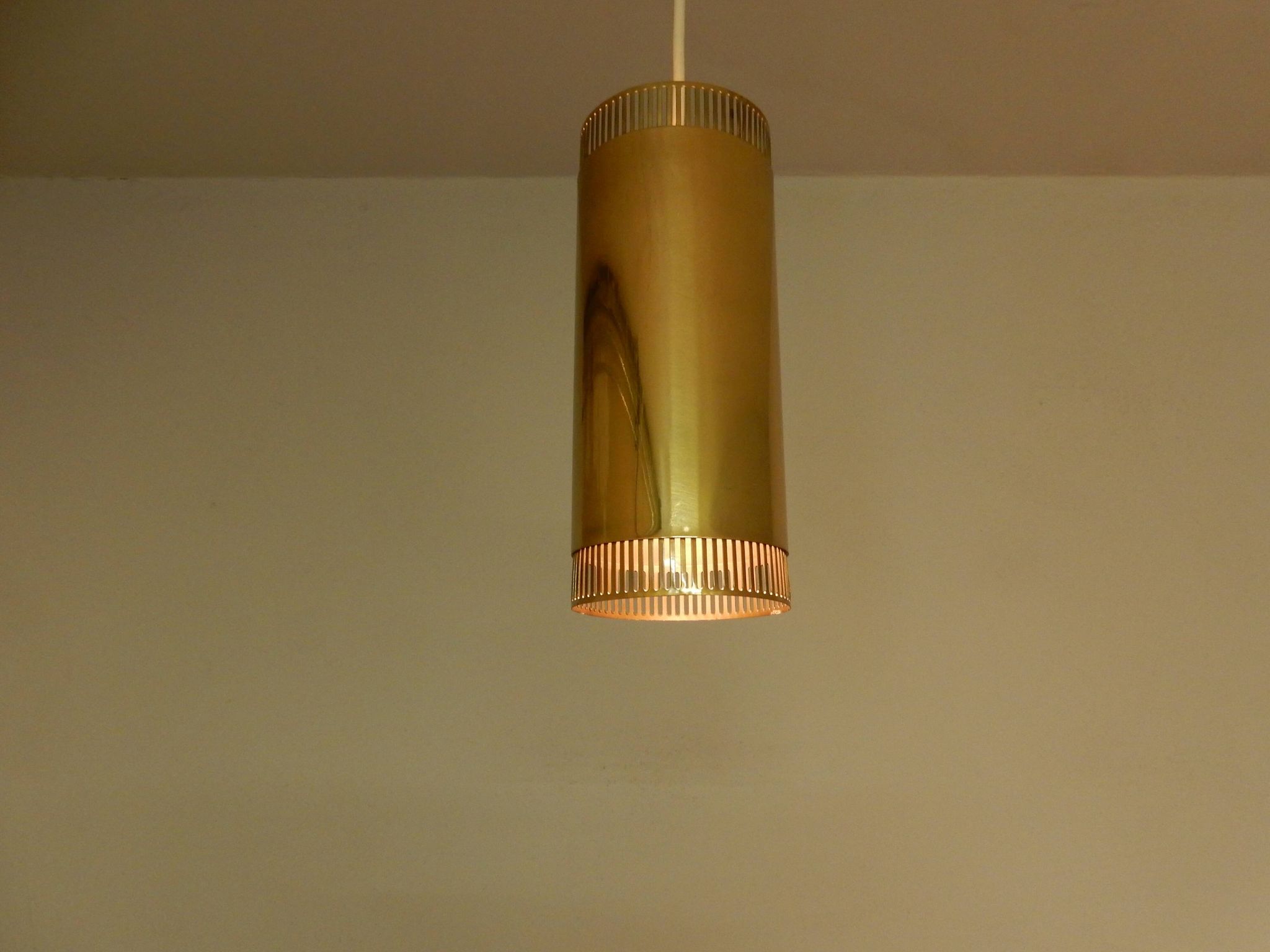 Set of 3 perforated brass cylindrical pendant lamps, Sweden 1960's