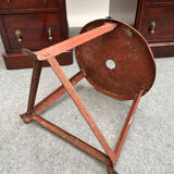 Red tripod industrial metal stool