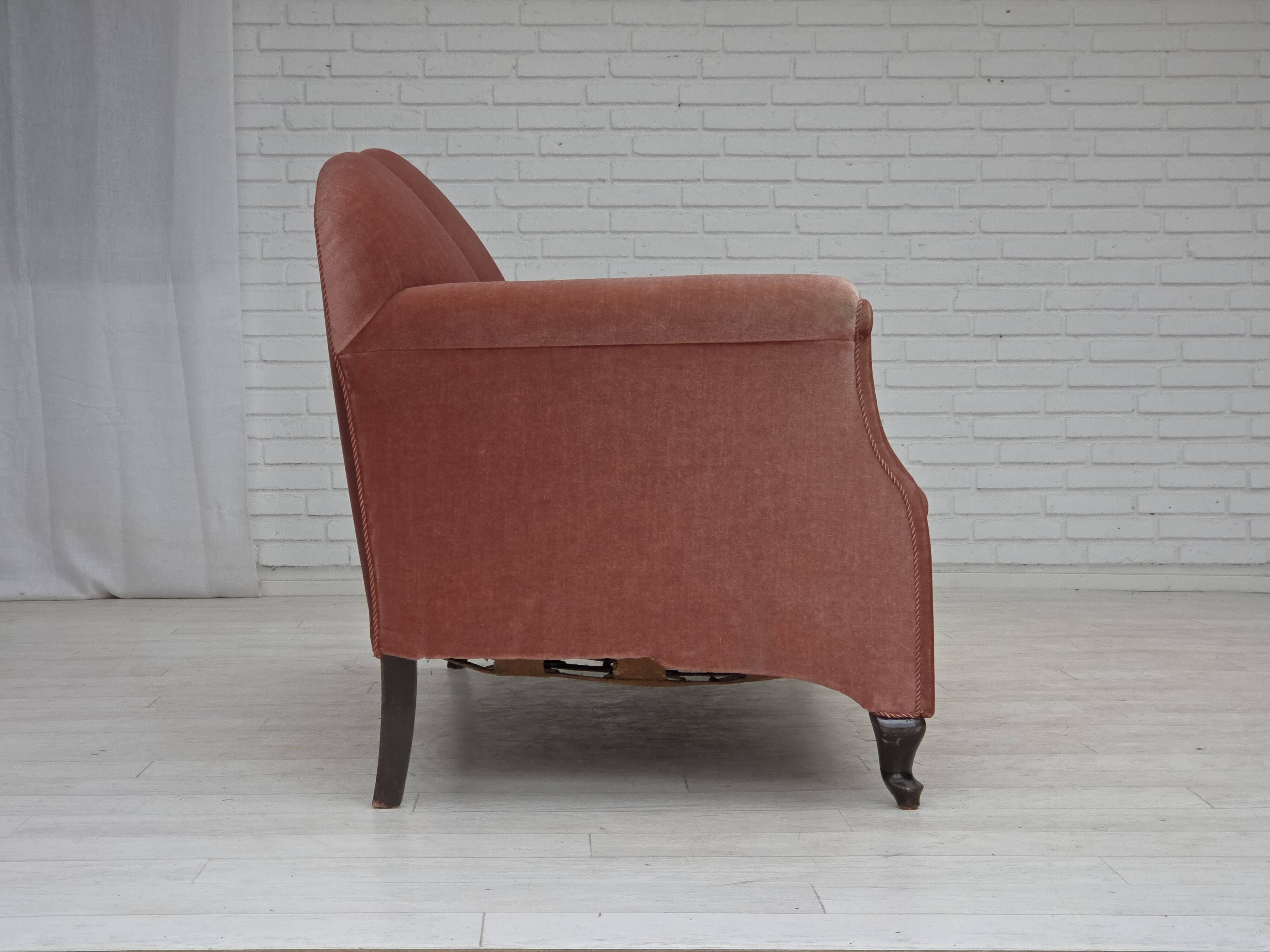 1950s, Danish 2-seater sofa, salmon pink furniture velour, oak wood legs.
