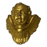 Antique cherub head in gilded wood from the early 20th century.