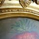 Large oil on canvas bouquet medallion wooden frame gilded stucco vintage