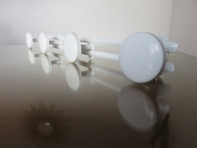 White metal coat holder in 70s