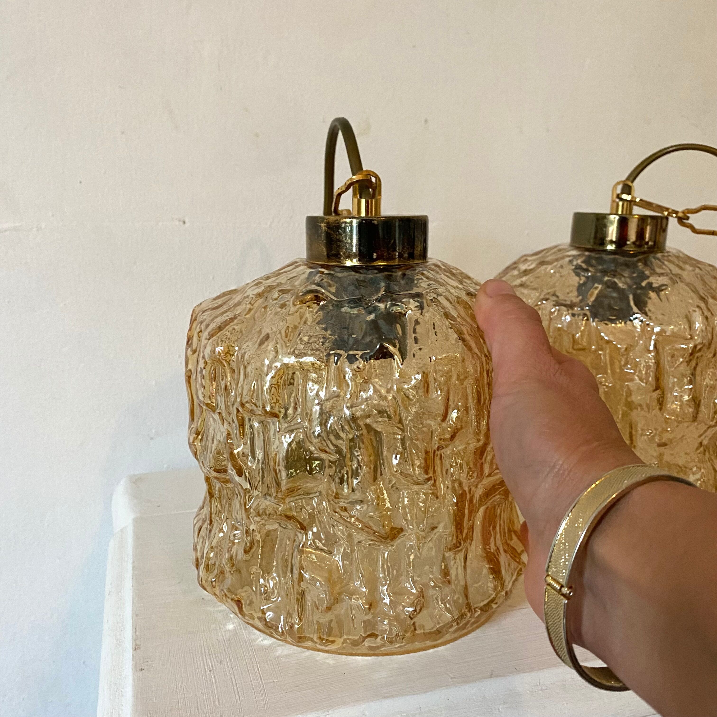 Pair of vintage amber glass pendant lamps
