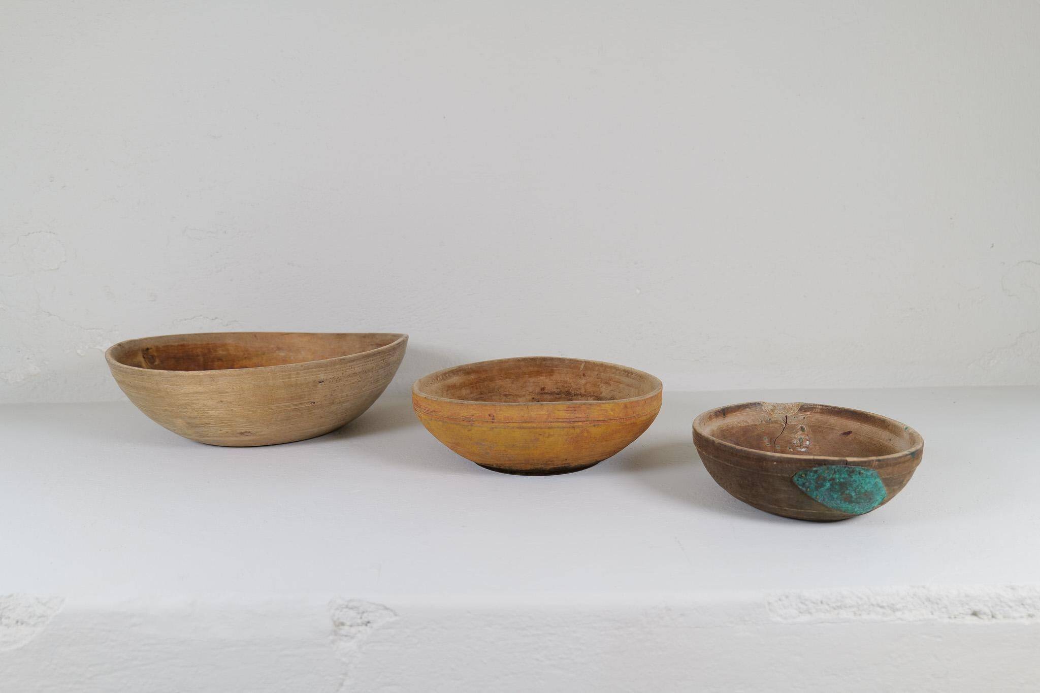 Set of three unique farmhouse bowls from 19th-century Swedish folk art.