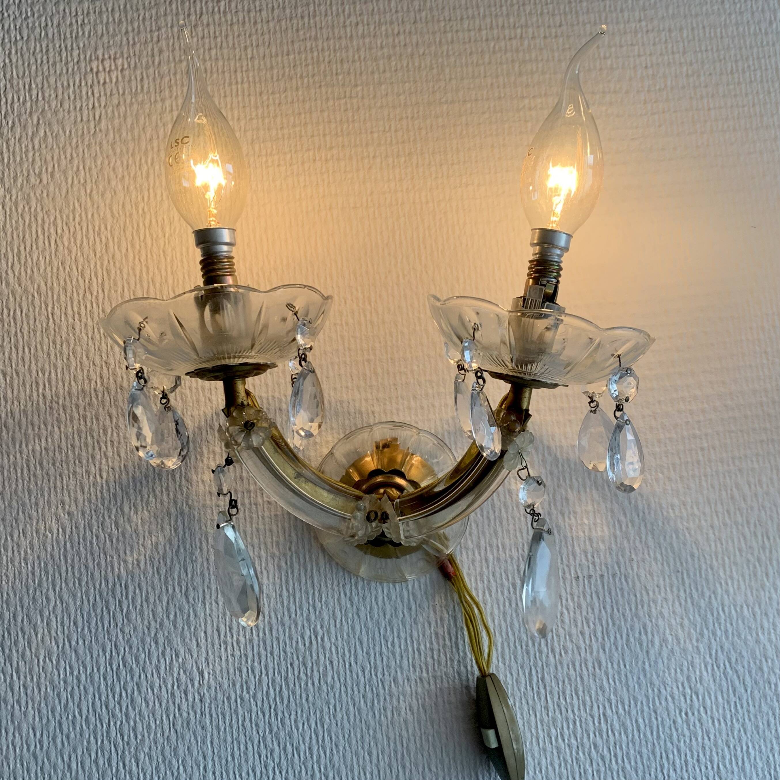 "Pair of vintage glass and brass wall sconces with tassels