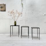 Suite of metal and glass nesting tables.