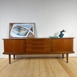 Vintage teak sideboard with rounded edges and sliding doors – mid-century Scandinavian design.
