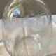 Carved glass decanter with floral decorations