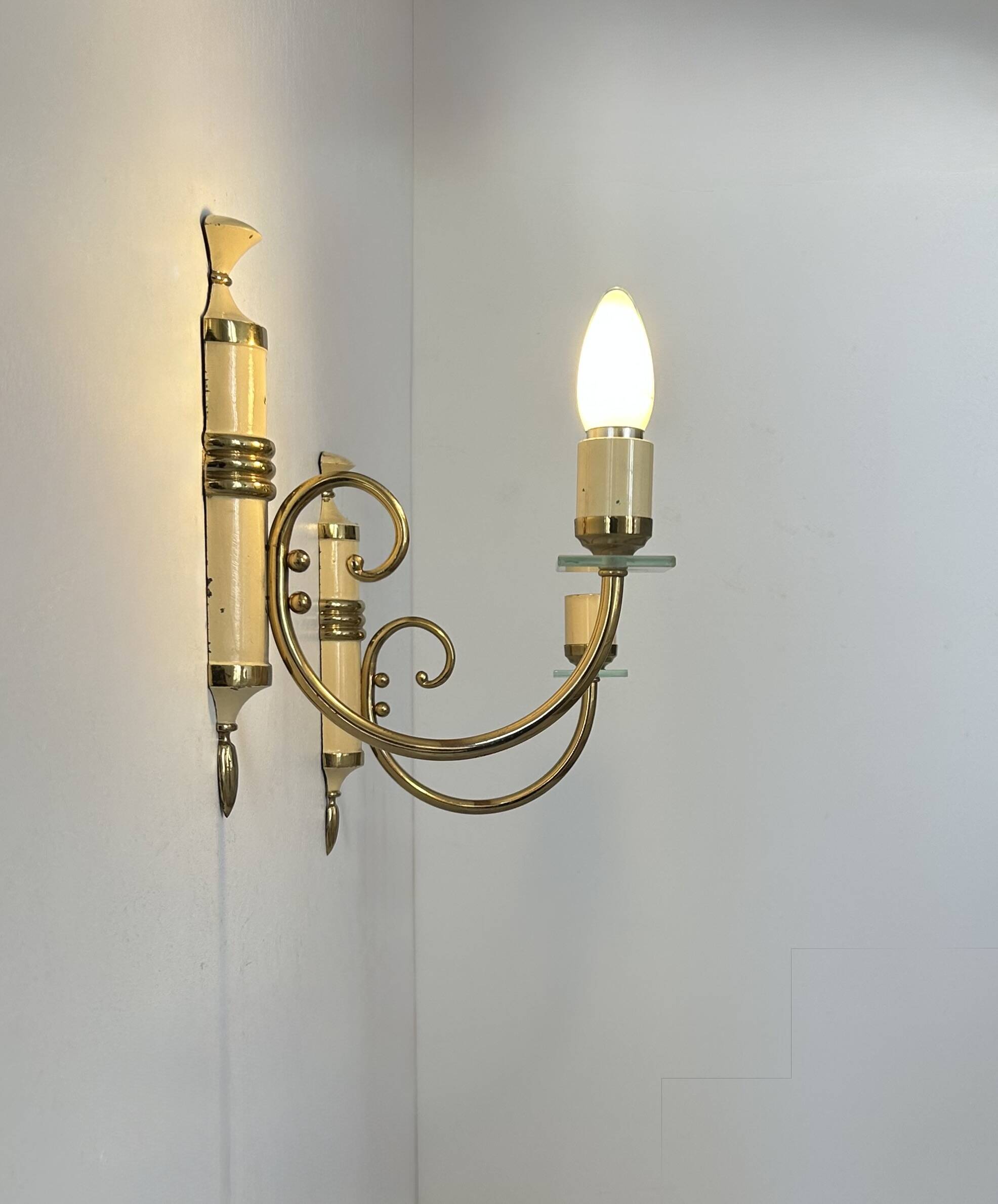 Pair of vintage patinated brass wall lights, France, 1940s