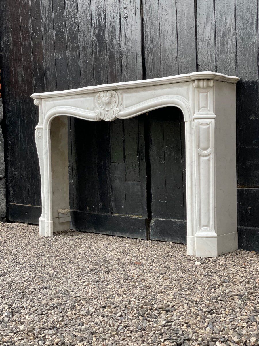 Louis XV style fireplace in Carrara marble