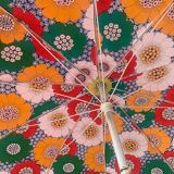 Large floral tilting beach umbrella with cotton fringes, 1960