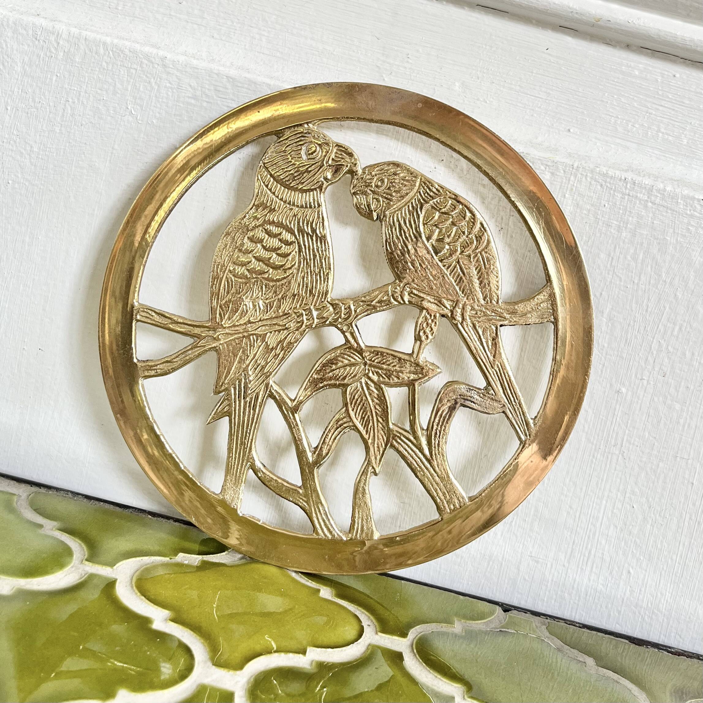 Small brass trivet with parrots or inseparable birds