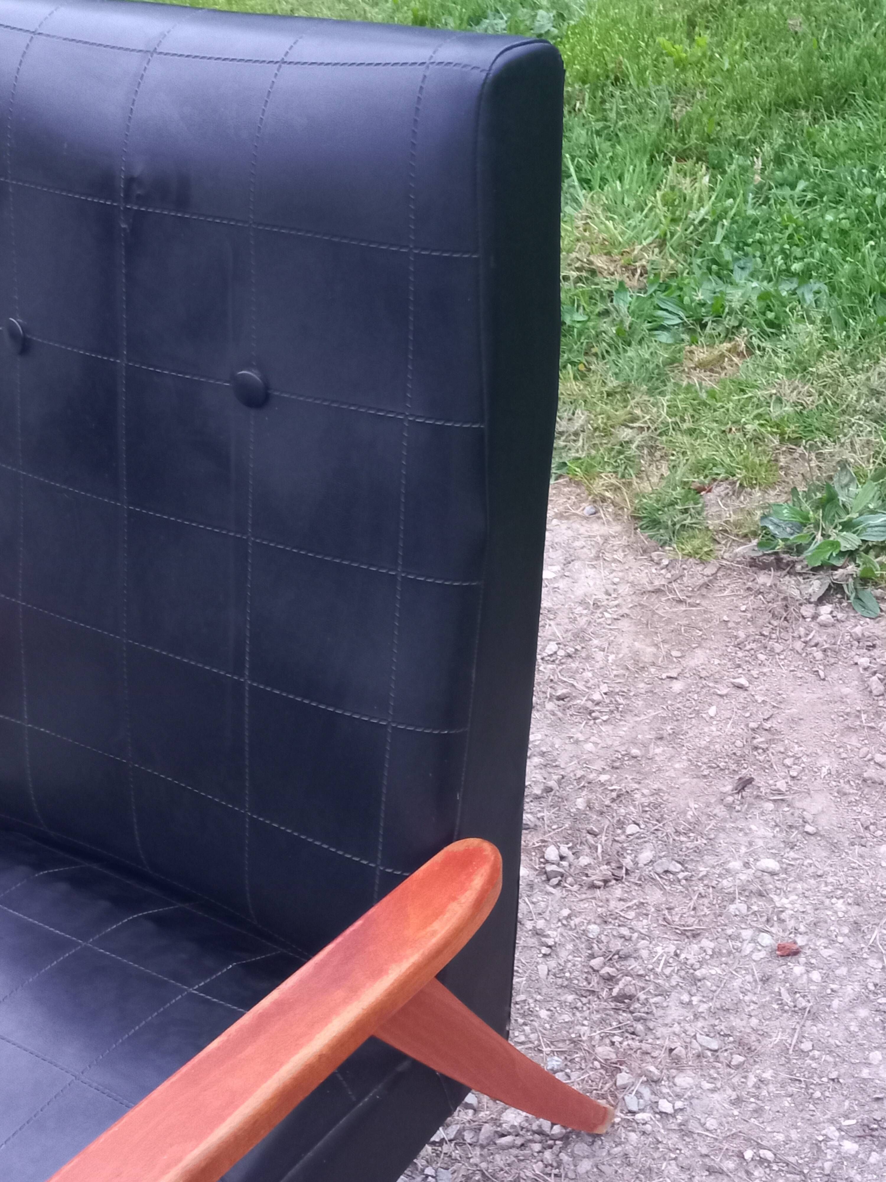 Pair of vintage beech armchairs feet compass covered with black moleskine from the 50s