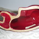 Saint Clement. Dog lying in earthenware