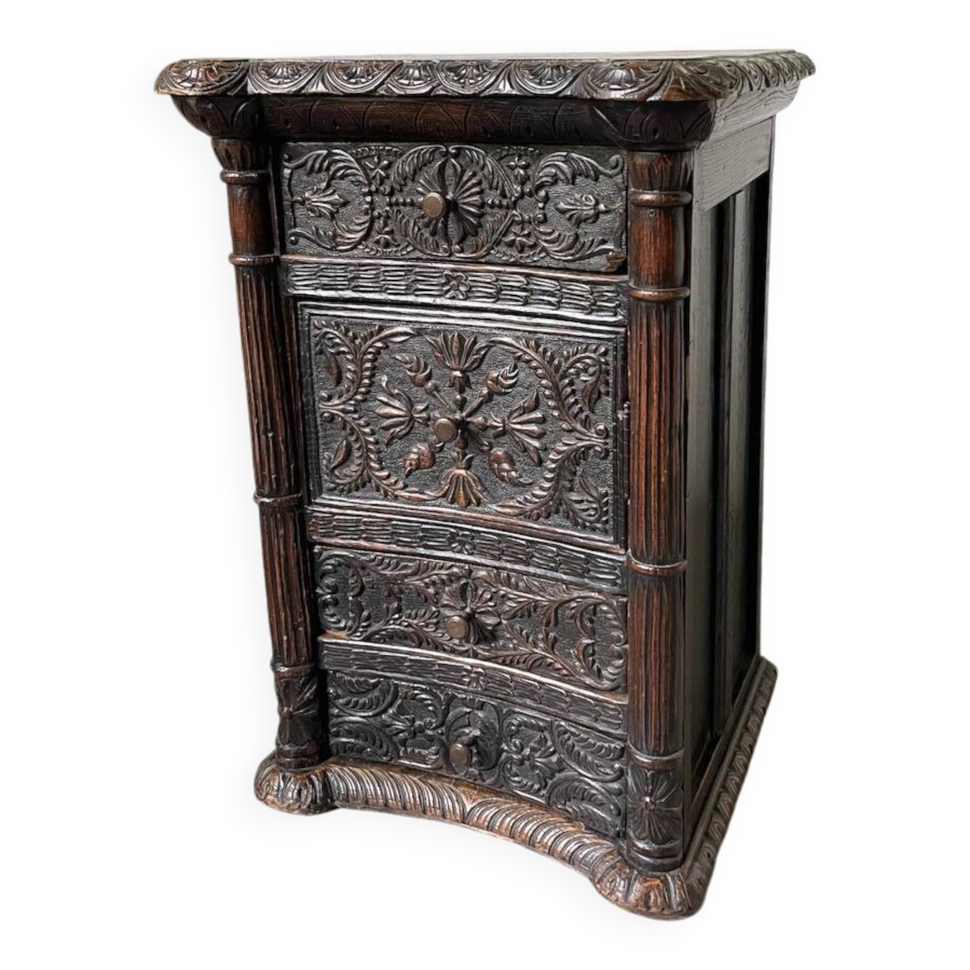19th century chest of drawers in carved blackened pine