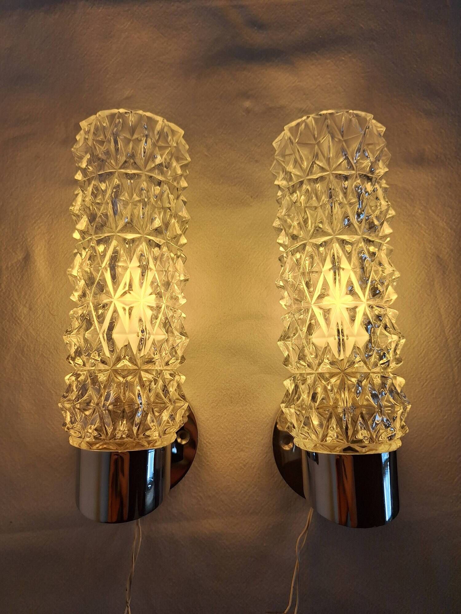Pair of vintage Art Deco space age chrome and molded glass wall sconces