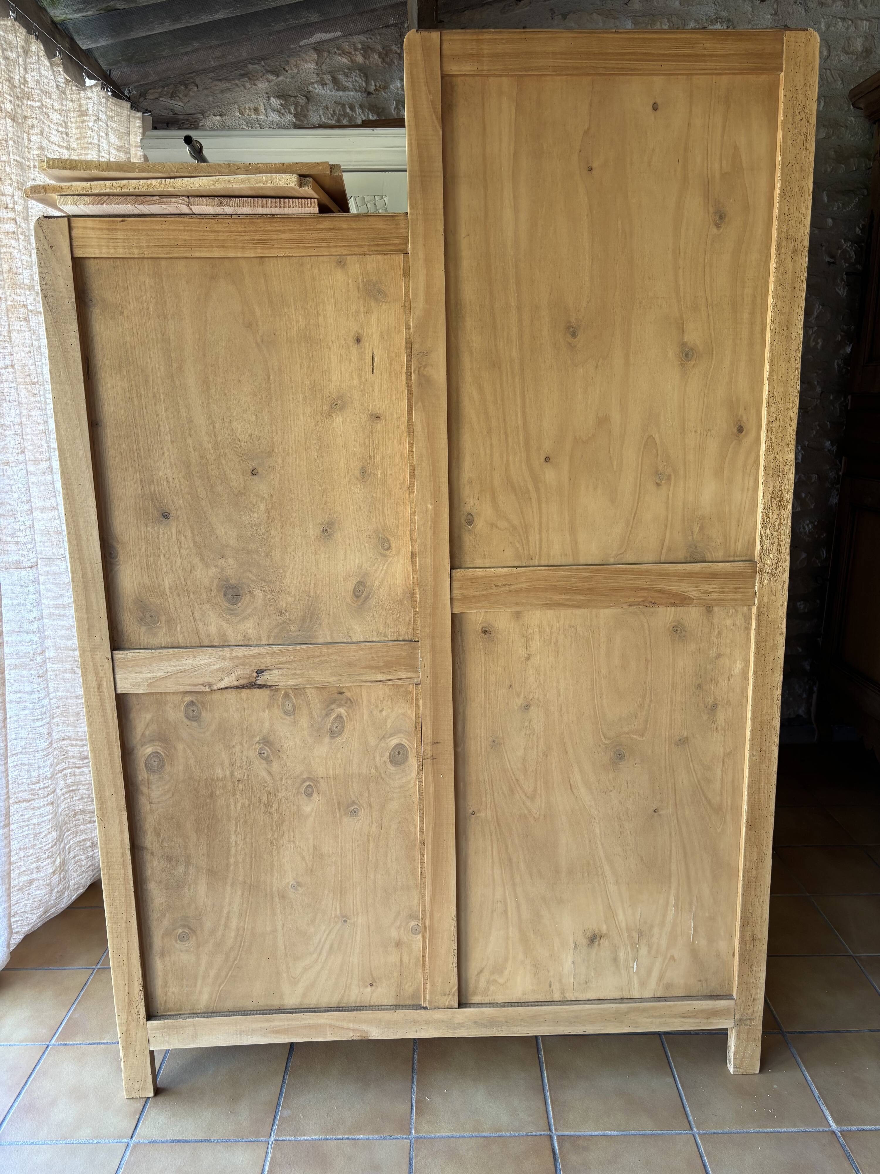 Asymmetrical Wardrobe in Raw Wood