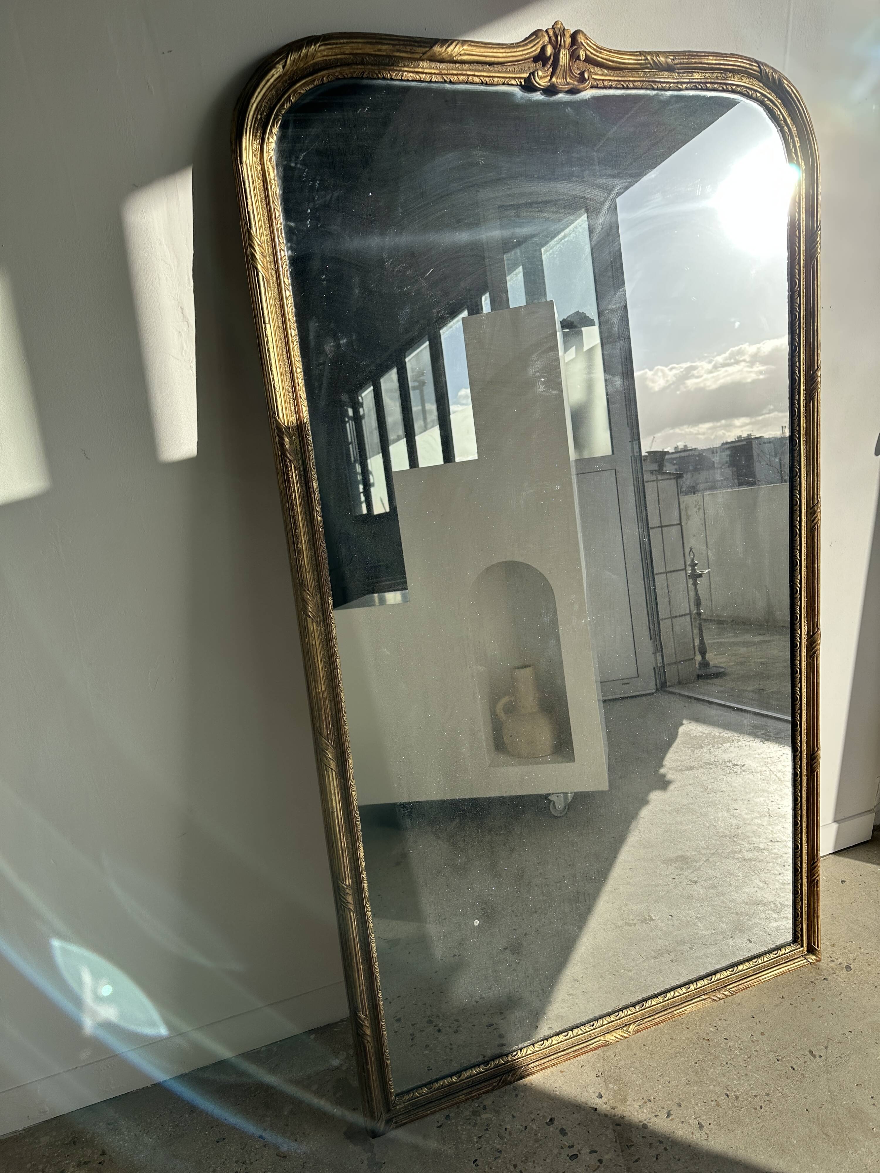 Large gilded mirror 19th century rounded corners mercury glass Louis XVI style