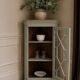 Vintage English corner display cabinet enhanced in grey-green with a wooden top.