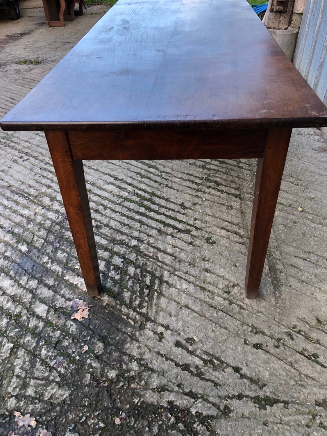 Antique chestnut farmhouse table with 3 drawers on the front.