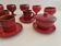 Red enamelled terracotta: cups, saucers, glasses