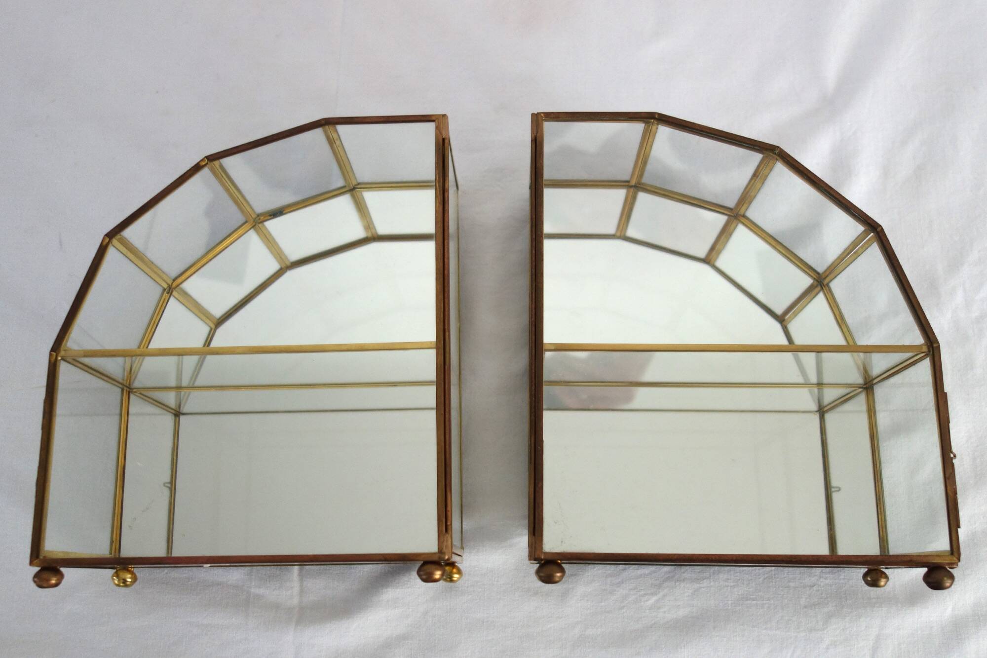 Pair of gilded brass, glass, mirror display cases from the 60s