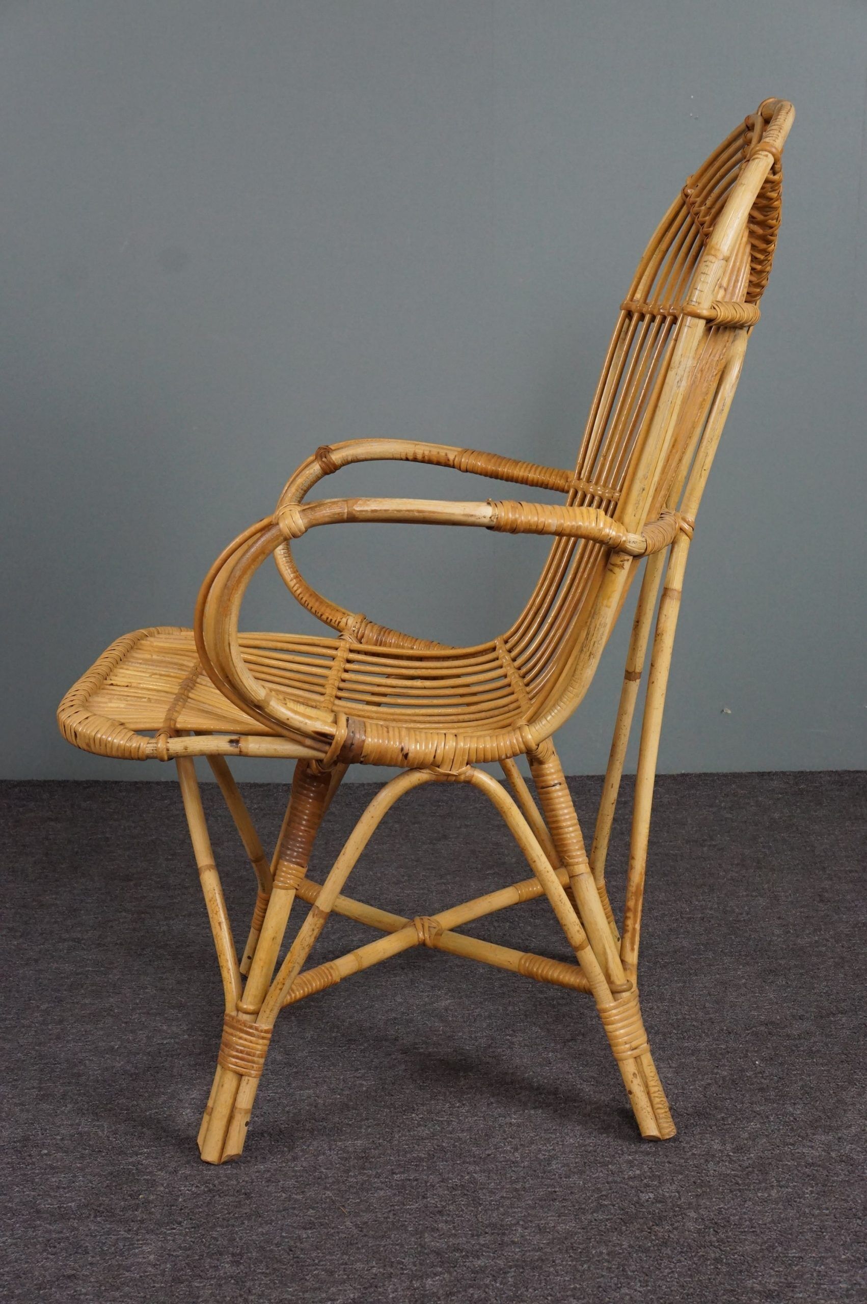 Rattan armchair with armrests by Rohé Noordwolde