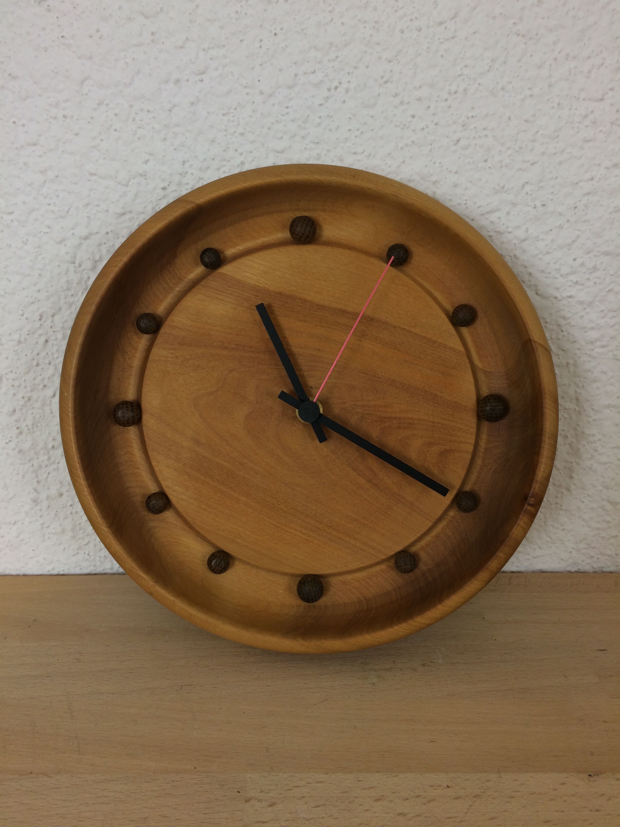 Wall clock in elm wood design