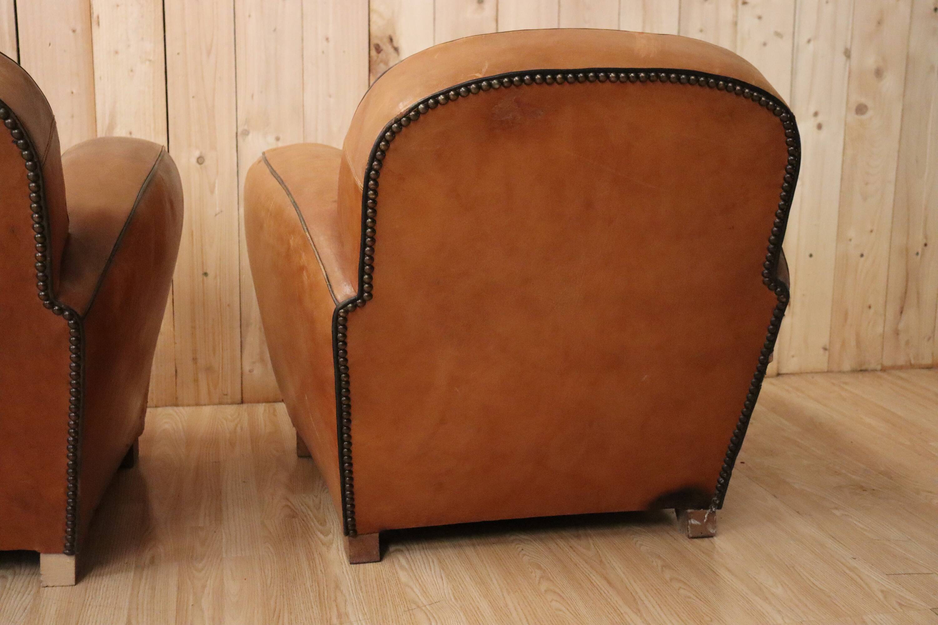 Pair of Art Deco leather club armchairs from the 1930s.