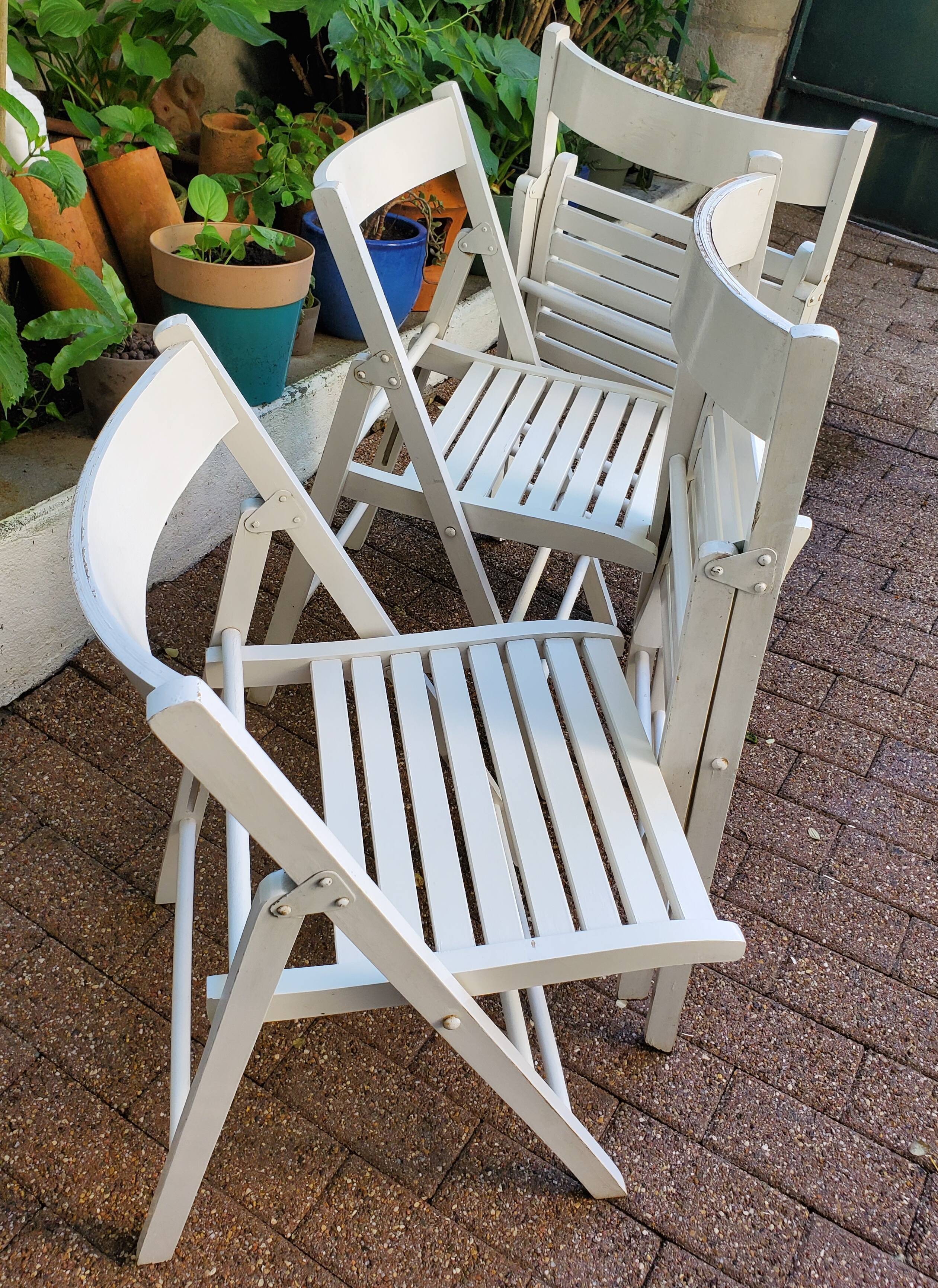 4 folding chairs made of 70's wood