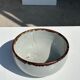 Small white glazed ceramic bowl black edges