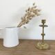 Chiseled brass candle holder