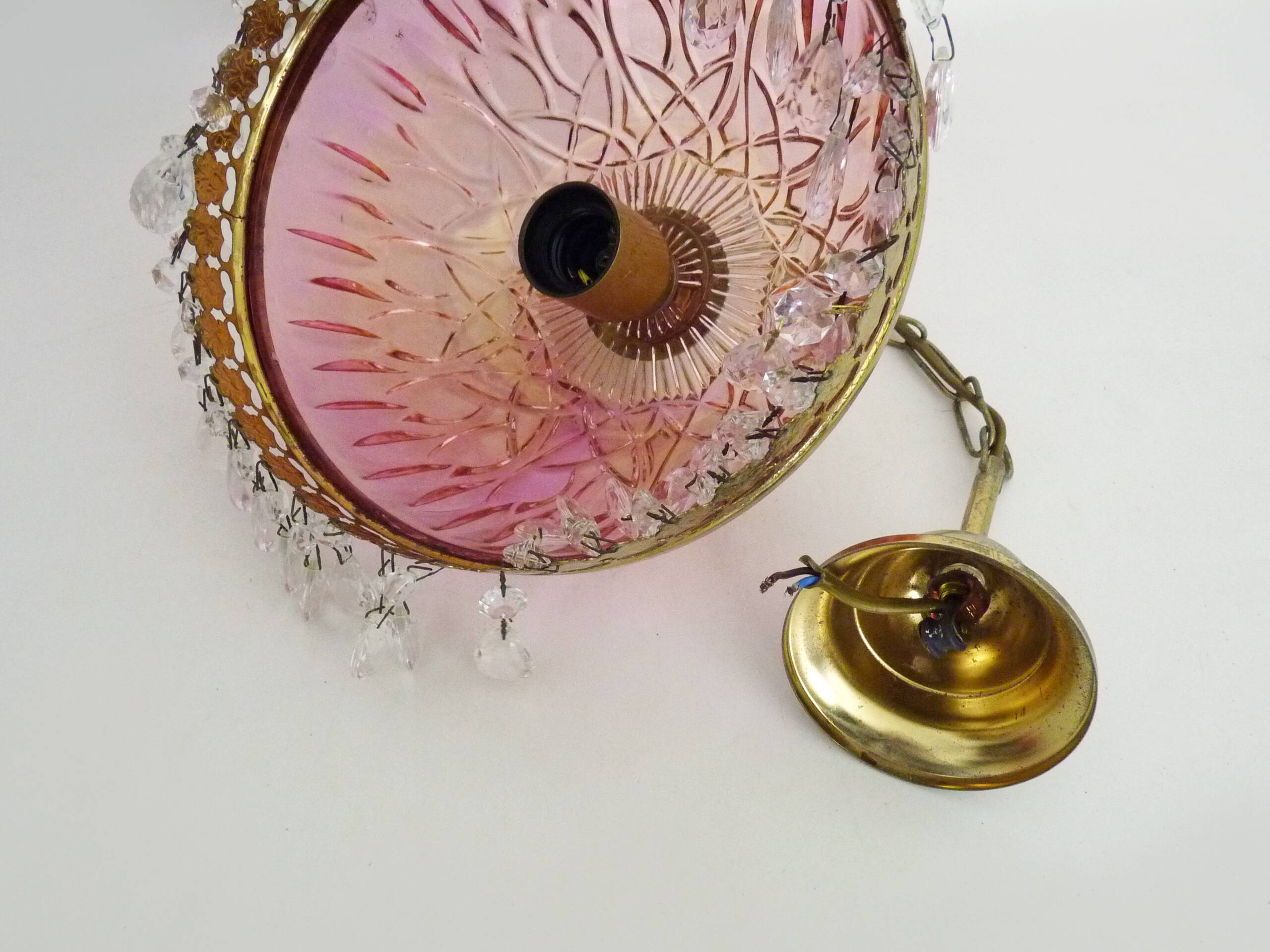 Vintage rose pendant light with pendants and patterned glass globe.