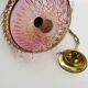 Vintage rose pendant light with pendants and patterned glass globe.