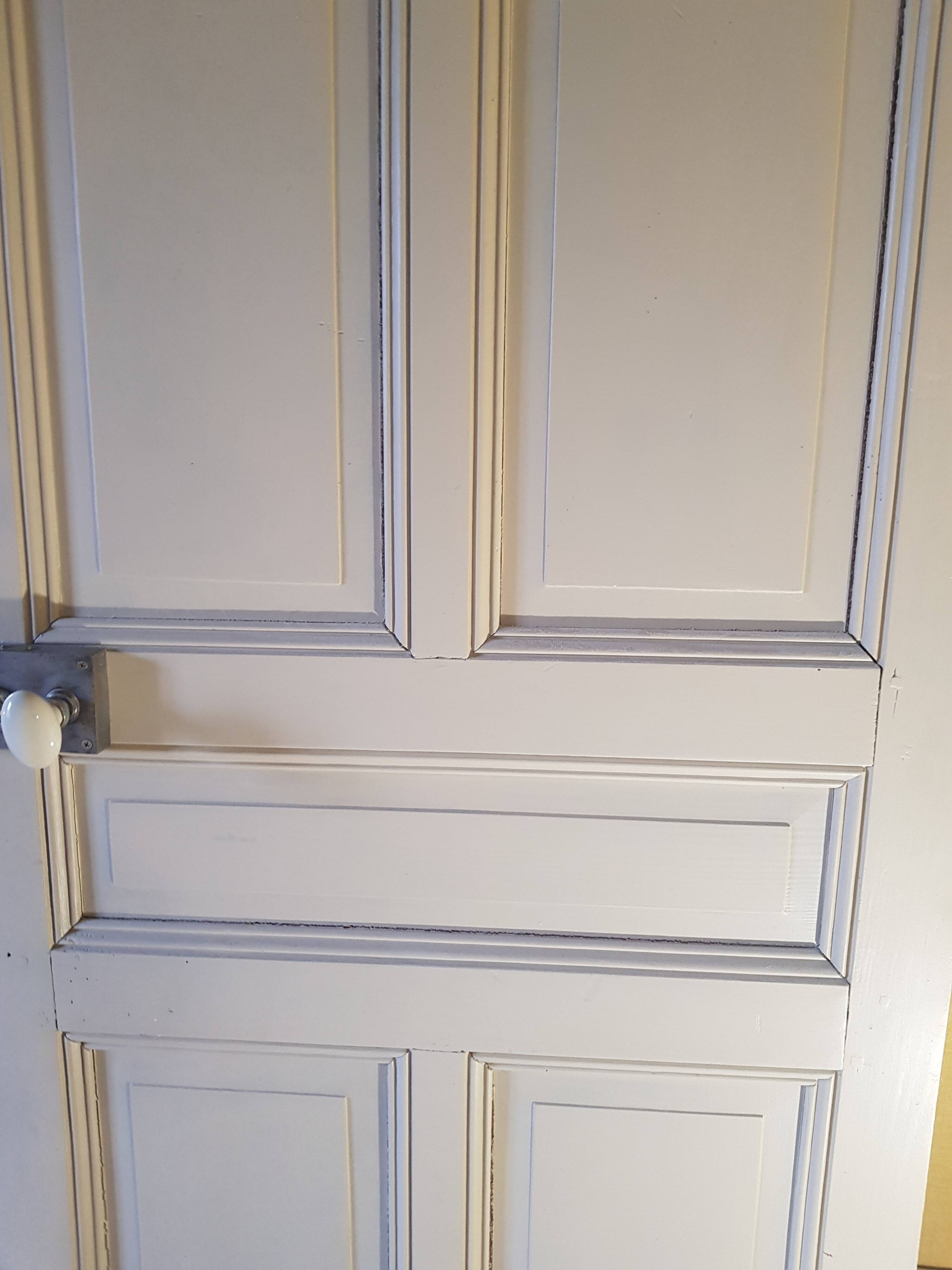 Large painted oak interior door with its hinges