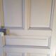 Large painted oak interior door with its hinges