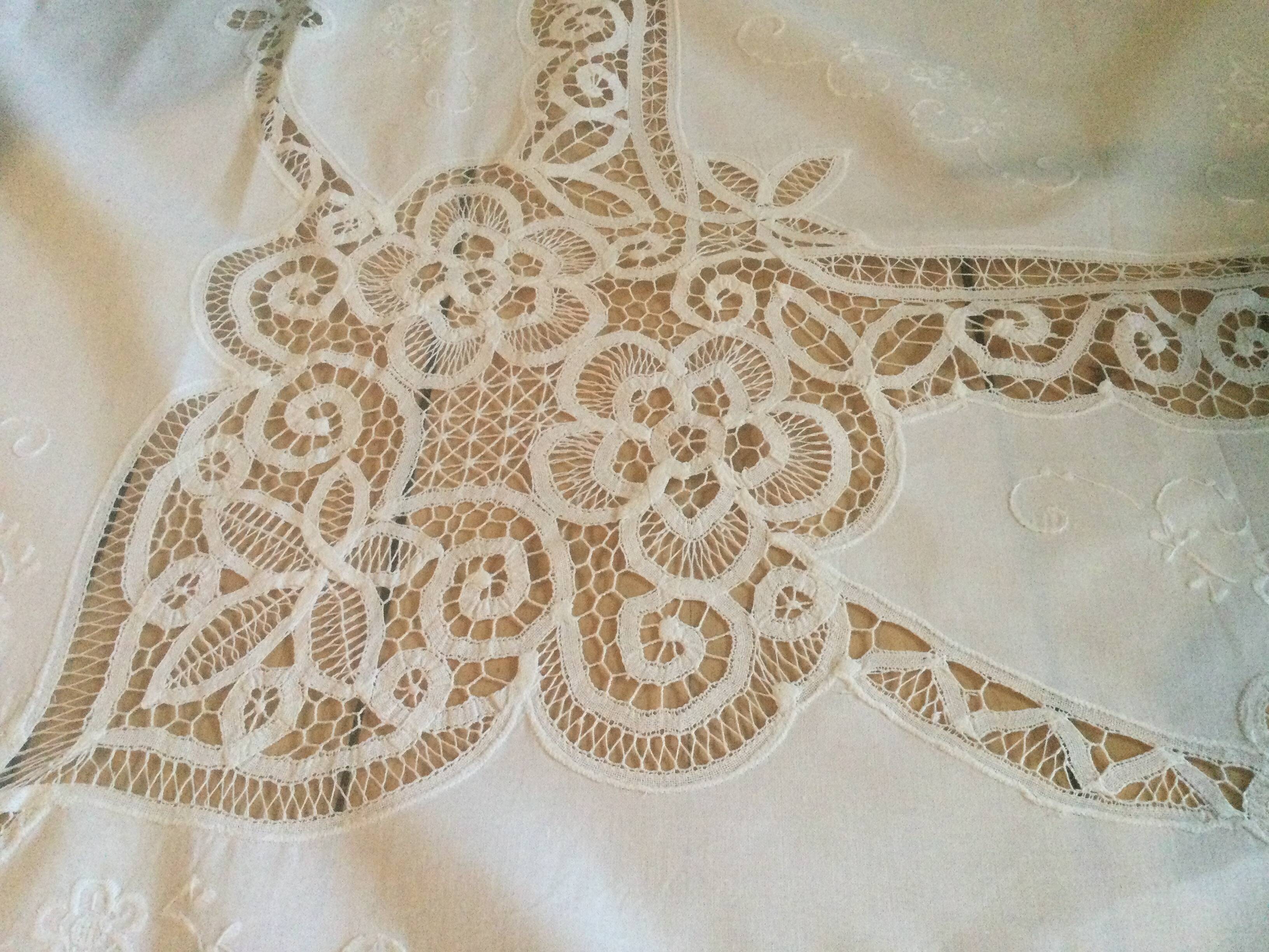 Embroidered white tablecloth and lace