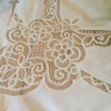 Embroidered white tablecloth and lace