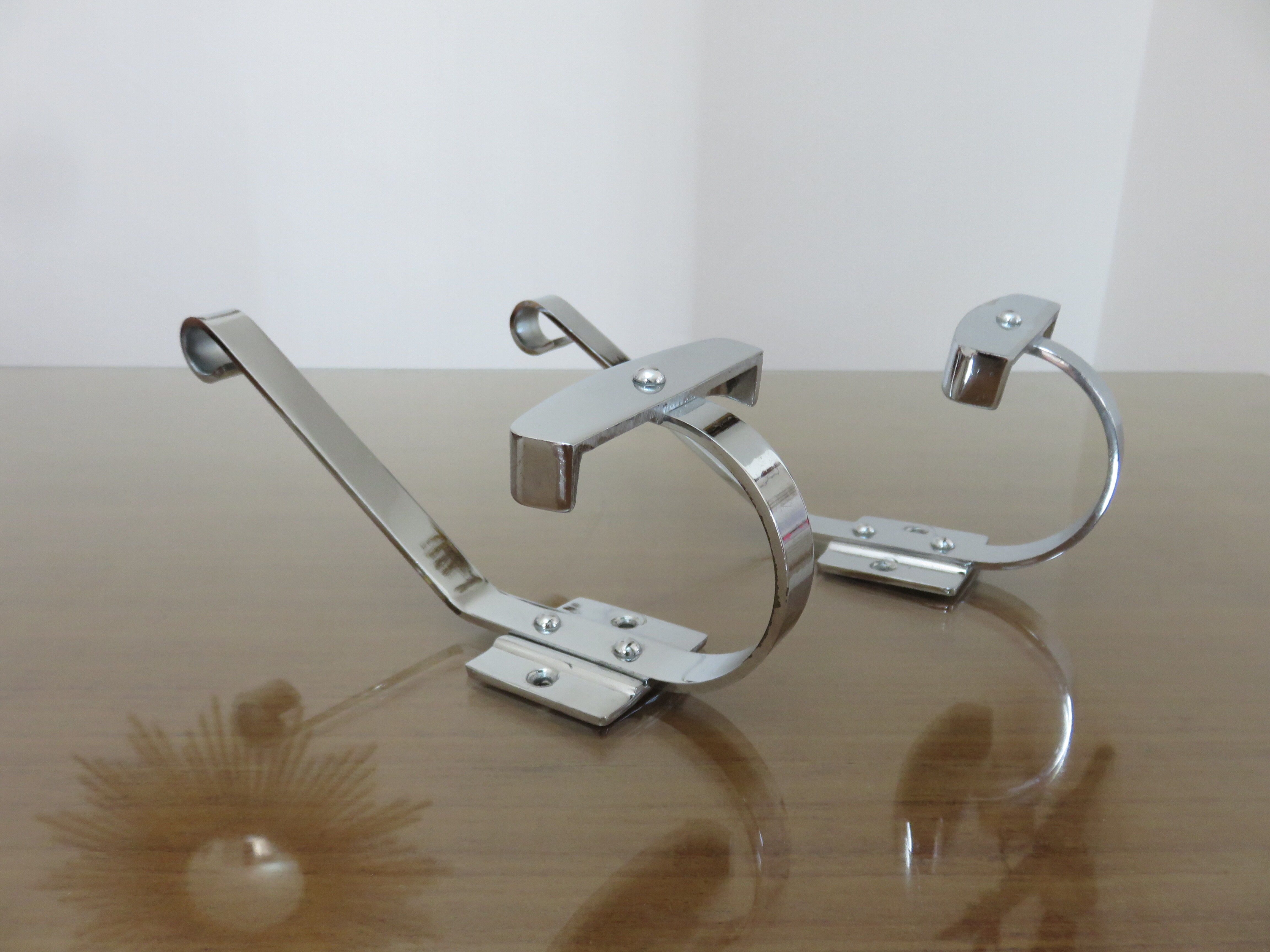 Pair of chrome metal coat hooks from the 1970s.
