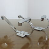 Pair of chrome metal coat hooks from the 1970s.