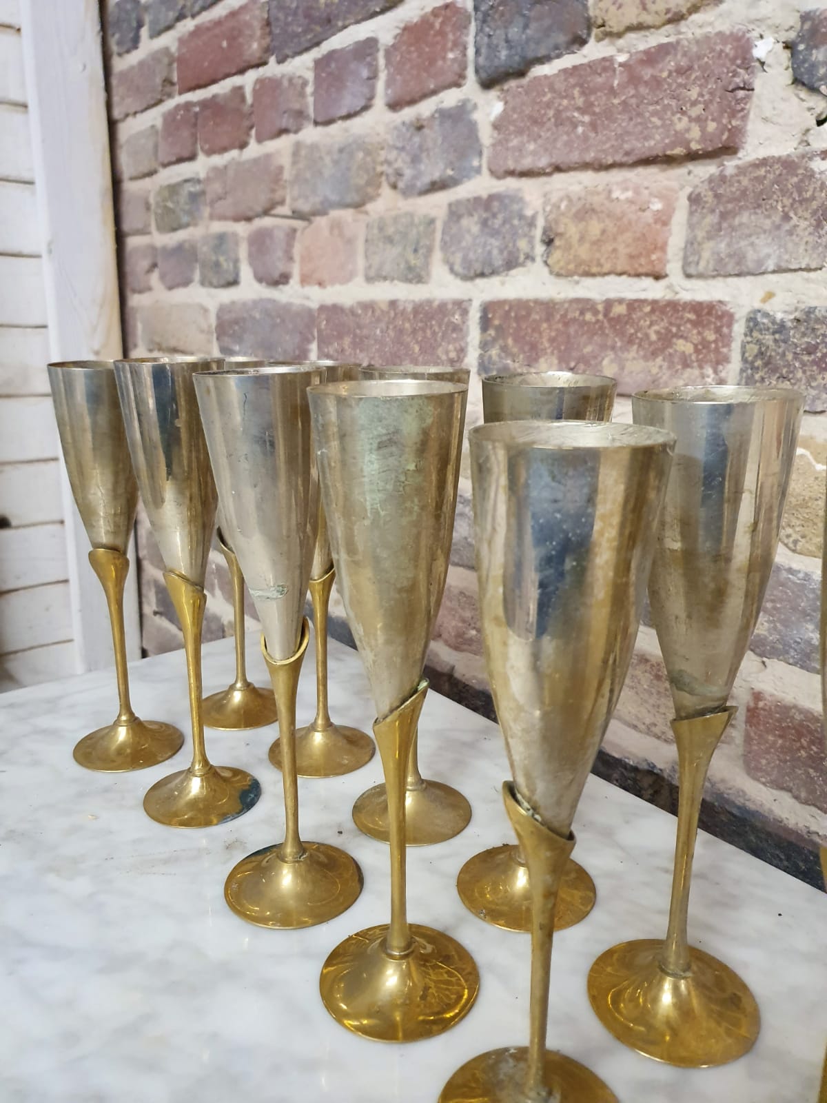Lot of 11 brass champagne flutes