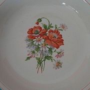 Hollow earthenware dish Saint Amand early twentieth floral decoration