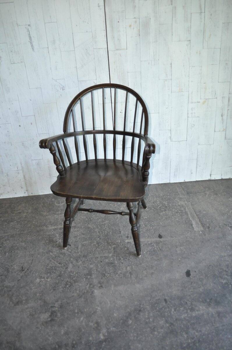 Brown wooden Windsor chair, 19th century — slatted backrest and carved seat