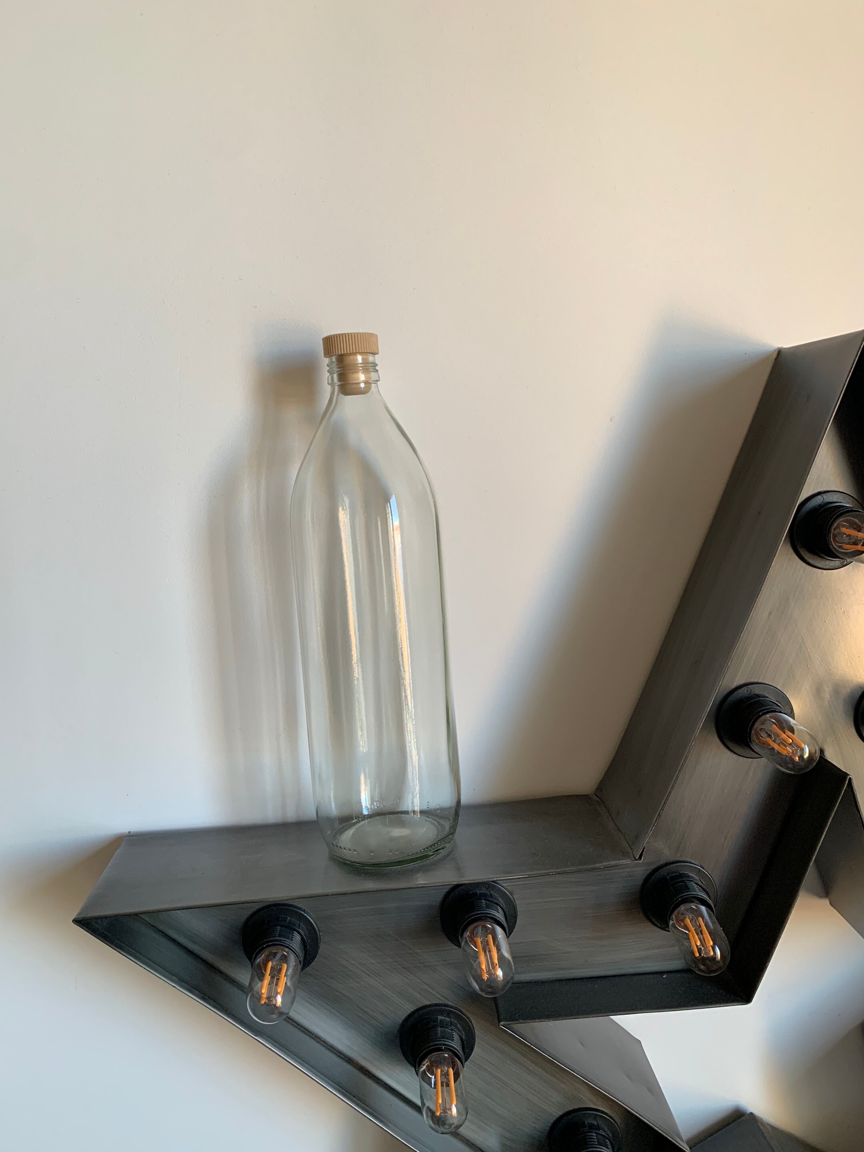 Antique glass bottle with a capacity of 1 litre and its beige cap - in very good condition!