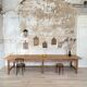 Solid wood workshop table with straight legs.